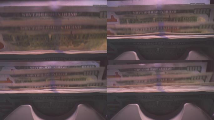 在机器银行业务中处理的美元货币的特写镜头
