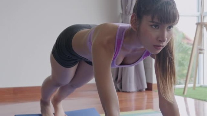 健身女性锻炼，腹肌，腹部，锻炼，正面观。美丽的亚洲女人在体育。