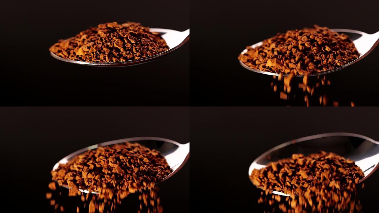 黑色背景上慢动作从勺子上掉下来的速溶咖啡块的特写