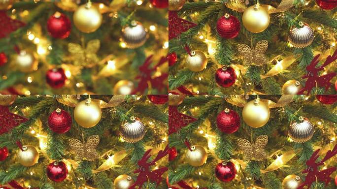 上面闪烁着金色和红色装饰品的圣诞树上的灯-停止运动