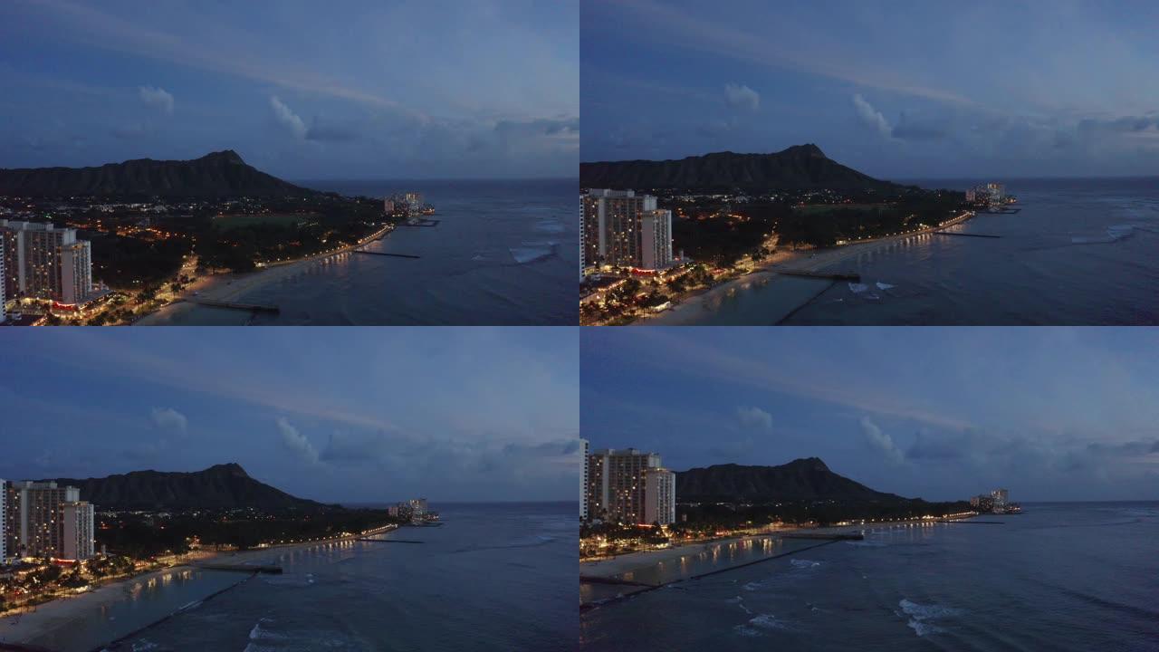 从无人驾驶飞机悬停在酒店上方时，从檀香山威基基海滩的鸟瞰图
