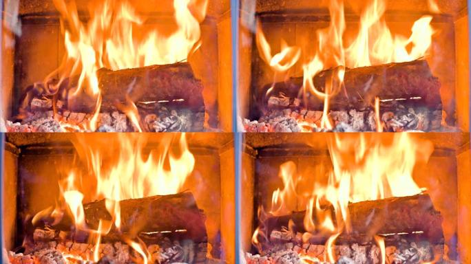 白天在耐火玻璃后面的自制现代炉灶中燃烧柴火的特写镜头。环保能源