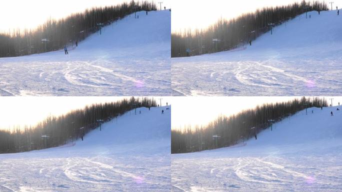 滑雪者在冬季滑下山坡