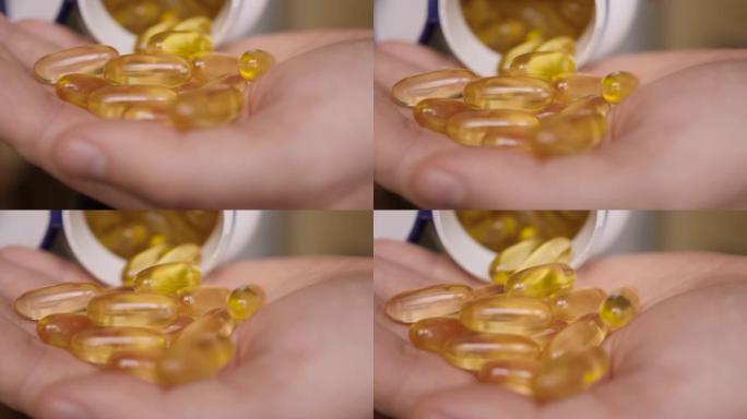 欧米茄3黄金鱼油胶囊。天然药物，运动，健康的生活方式，补充剂，饮食，营养，减肥，维生素d。男人倒鱼油