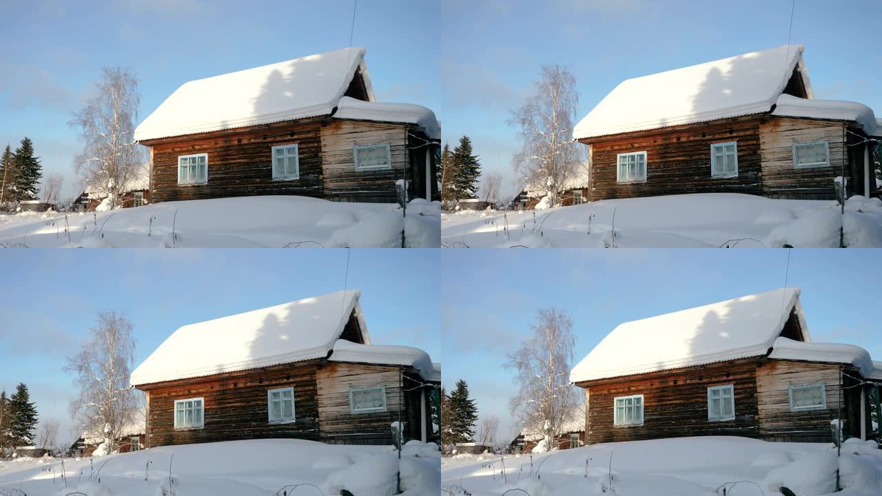 冬季景观。位于西伯利亚的俄罗斯村庄被雪覆盖的木屋的外观。俄罗斯。4K