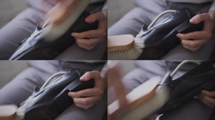 一个年轻的高加索人修理旧的男性皮鞋的特写镜头。