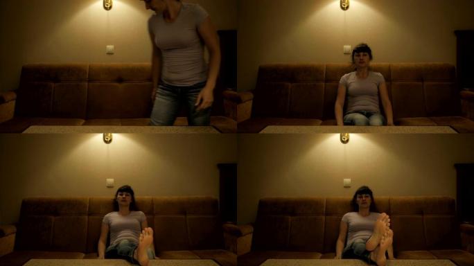 在电视上看电影的女人。放松的女人瘫坐在舒适的客厅的沙发上看电视。女性在客厅的沙发上看电视。