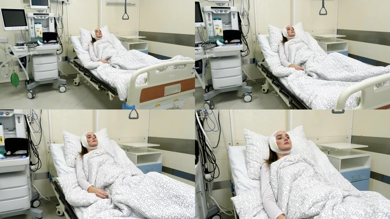 一位年轻的高加索可爱的女人在现代诊所接受整形手术后躺在医院病床上的正面视图。4K