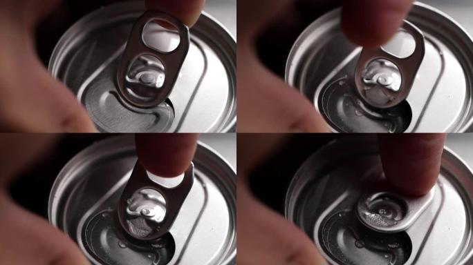 慢动作打开啤酒或汽水罐的特写