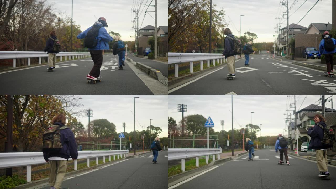 日本年轻女滑板运动员骑在住宅区的道路上