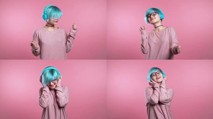 蓝色头发不寻常的女人在粉红色背景下的工作室里玩得开心，微笑，戴着耳机跳舞。音乐、舞蹈概念、慢动作