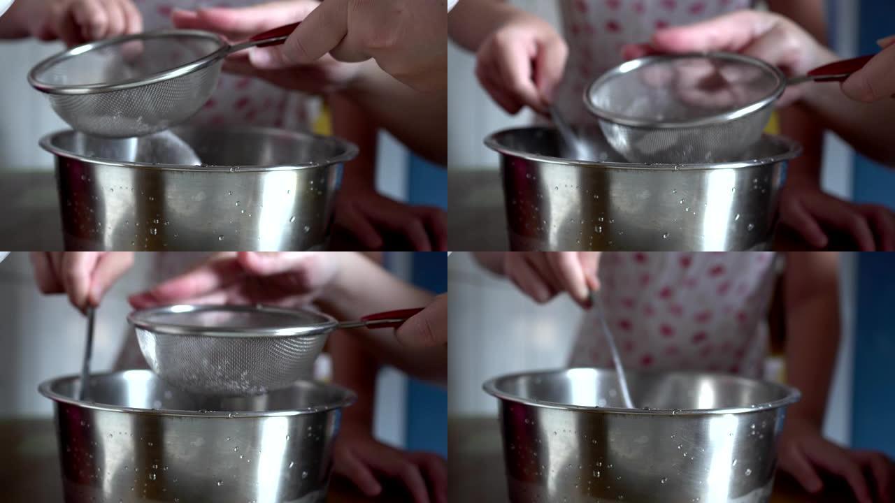 用筛子过滤玉米淀粉。用勺子搅拌。制作手工蛋糕的准备工作。