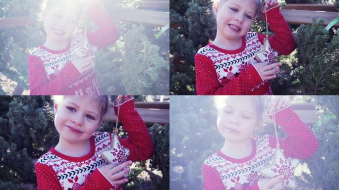 圣诞树农场上穿着红色连衣裙的小女孩。