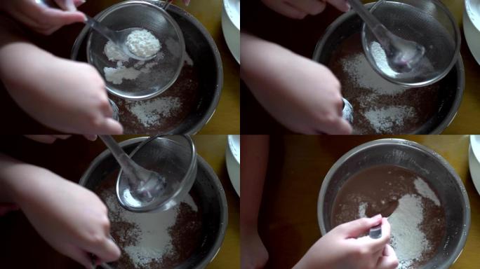 用筛子过滤玉米淀粉。用勺子搅拌。制作手工蛋糕的准备工作。看过去。
