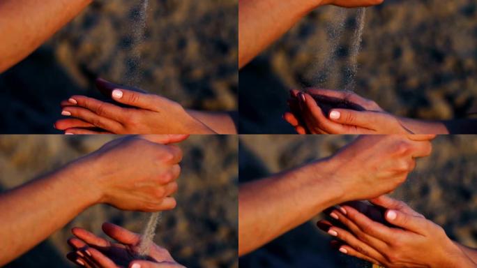 男人在日落时将沙子撒在女人的手中