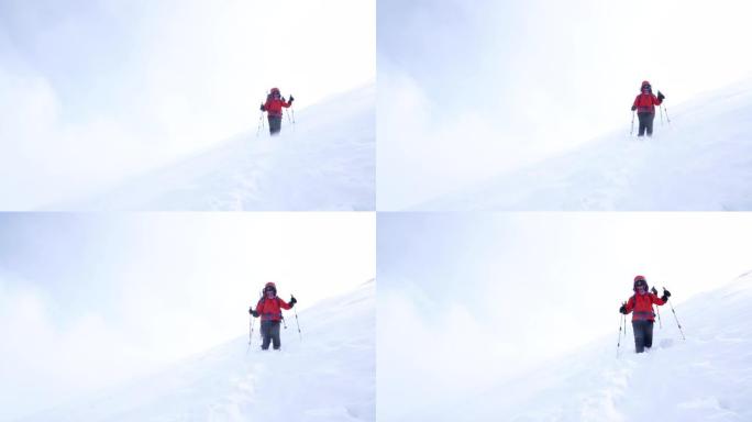 高山登山队冬季登顶高海拔山峰