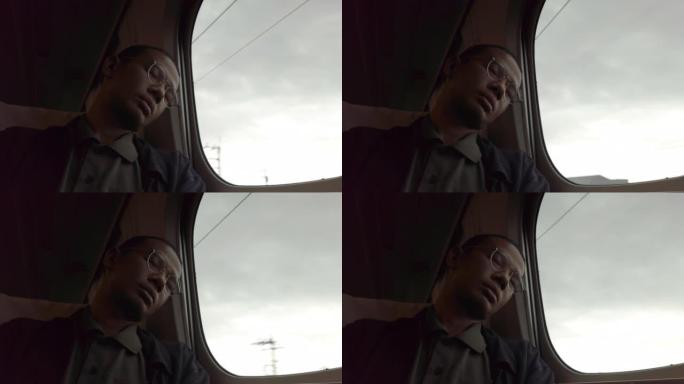 男子在火车上小睡长途高铁动车