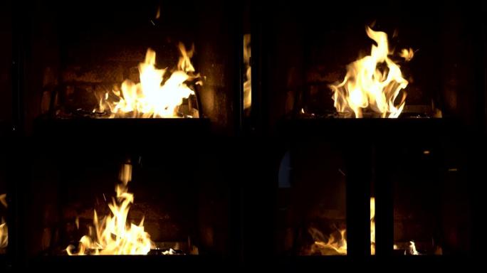 燃烧壁炉的玻璃门在没有人为干预的情况下自动打开和关闭。壁炉里的火。符号。概念。特写。4K。