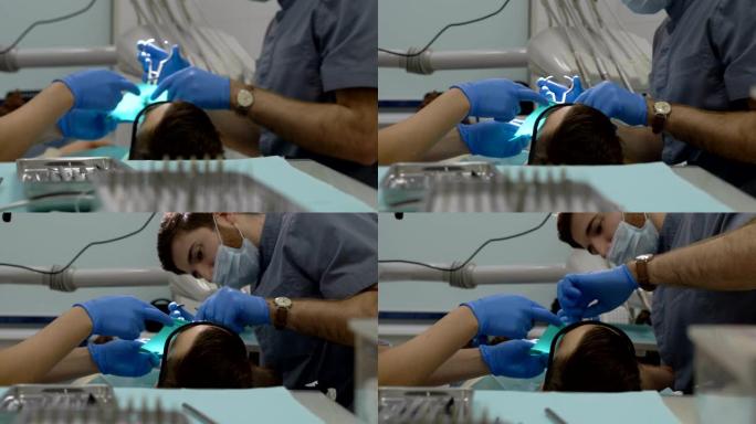牙科医生和助手为病人做手术准备