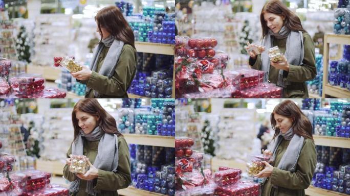 一个年轻漂亮的女人在商店里走来走去，挑选圣诞装饰品和装饰品庆祝新年。新年购物