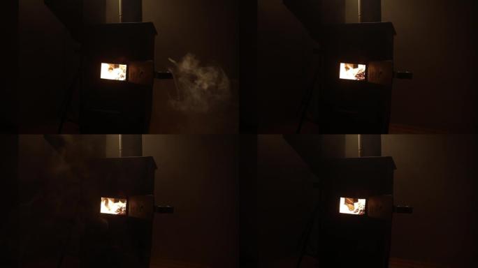 小黑铁炉里燃烧着火。传统阿塞拜疆坚果炉。具有选择性焦点的特写照片
