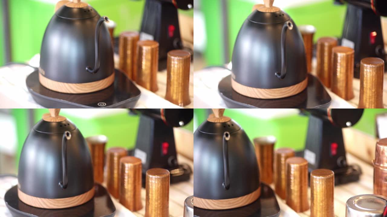 黑色水壶中水沸腾的4k视频。
