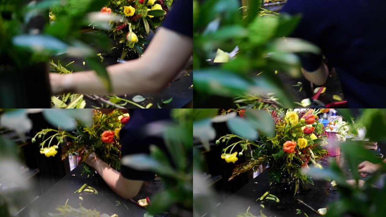 一个花店正在安排花束，手工拍摄