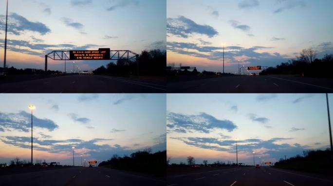 * 反向运动 * 驾驶晨间高速公路，光线照在地平线上。司机的观点POV州际公路清晨向后快速行驶。高速