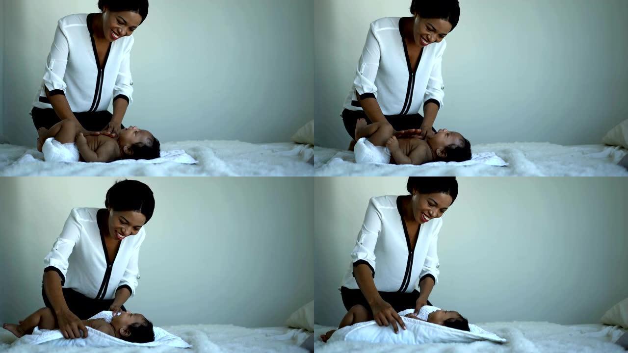 4k非洲母亲在哭泣时关心非洲新生男婴