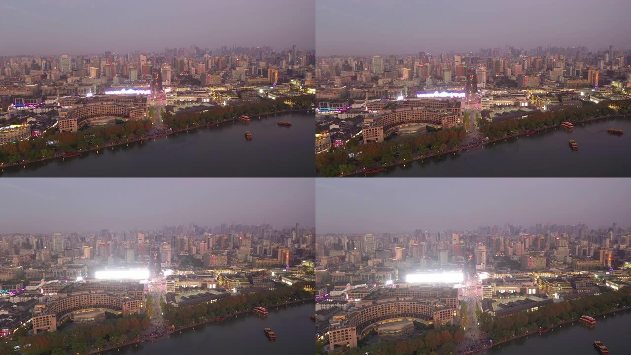 日落黄昏照明杭州市著名湖滨拥挤海湾空中全景4k中国
