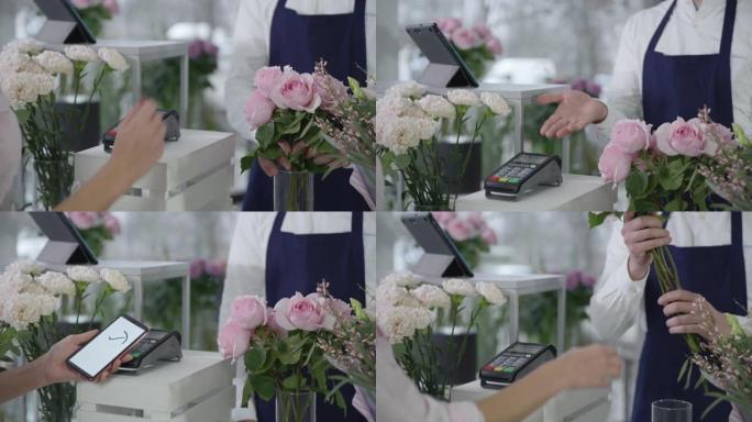 非接触式支付，在花店中买家使用手机在终端上支付一束鲜花，这是一个小型企业的概念