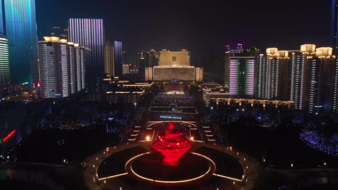 青岛市夜间照明秀市中心著名海湾广场空中全景4k中国
