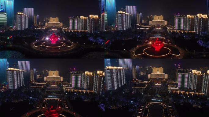 青岛市夜间照明秀市中心著名海湾广场空中全景4k中国