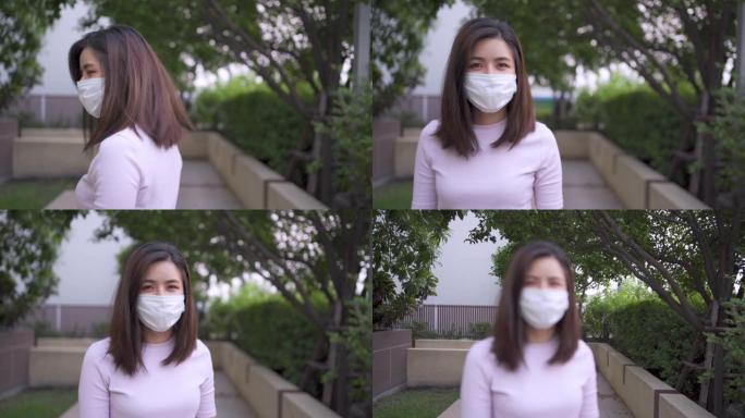 1080p亚洲年轻女性戴着口罩在户外附近走动时转身新型冠状病毒肺炎电晕病毒，病毒传播疾病，医疗保健概