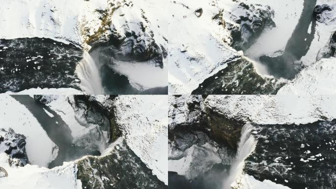 冰岛壮丽的著名瀑布Skogafoss的空中无人机视图。无人机在冰岛著名的Skogar瀑布上空飞行