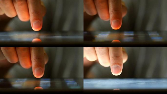 手指滑动并单击数字平板电脑触摸屏的极端特写