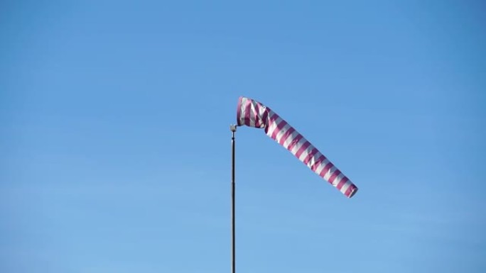 Windsock with red and white stripes show direction