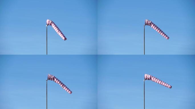 Windsock with red and white stripes show direction