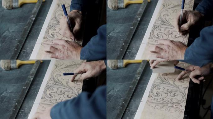 雕刻师用笔和复写纸在凹槽纸上划线