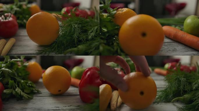 无法识别的人滚动橙色经过有机蔬菜