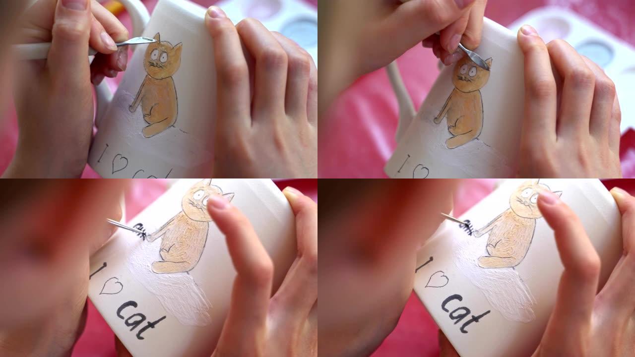 儿童在陶器车间画杯子。画一只猫。