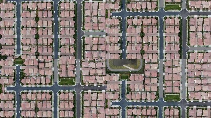 带道路的郊区拥挤房屋社区的鸟瞰图