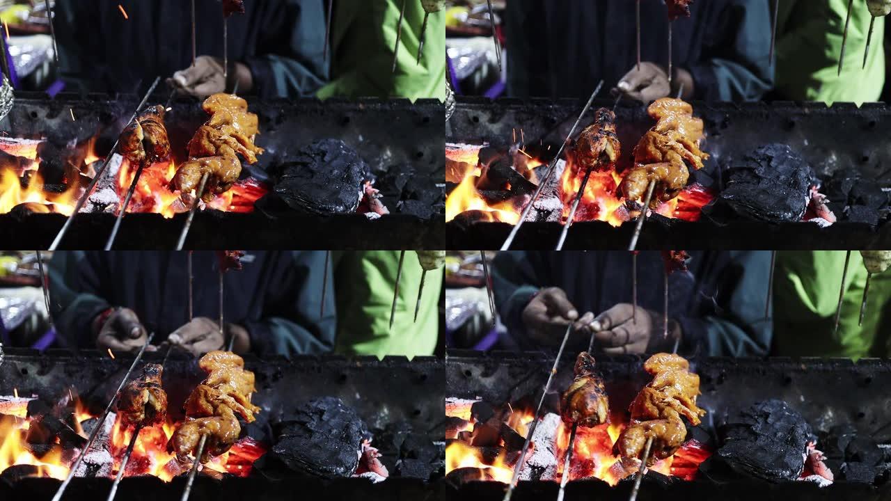 腌制鸡腿片tandoori在木炭上的烧烤火焰上烧烤