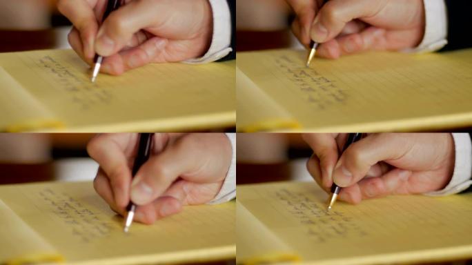 商人用钢笔在法律笔记本上手写信件特写