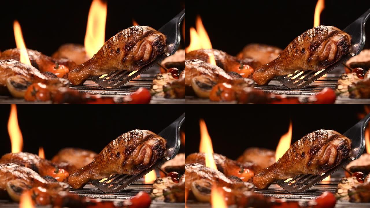 火焰烤架上的特写烧烤烧烤鸡腿，高清慢动作