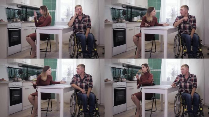 家庭危机，残疾人在轮椅紧张的情况下与一个积极进取的妻子尖叫和挥舞的手在沮丧中的不愉快关系