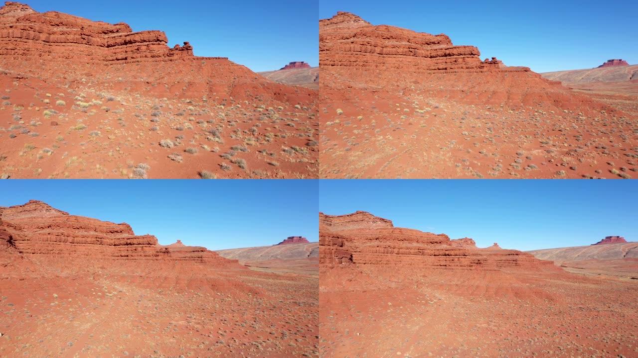 带有红色沙子和摇摇欲坠的岩层的干旱沙漠的航拍