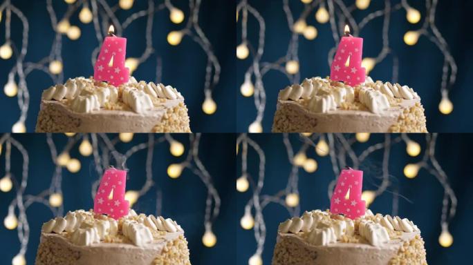 蓝色背景上有4号粉色蜡烛的生日蛋糕。蜡烛吹灭了。慢动作和特写视图