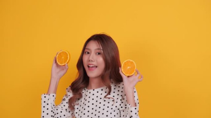 橙色水果美女亚洲女人