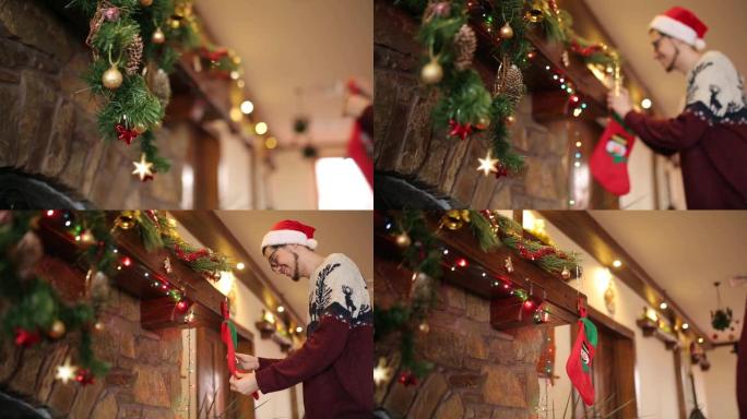 留着胡子的男人穿着针织衫和帽子，在壁炉上方悬挂圣诞袜或袜子，装饰着五颜六色的闪烁花环灯和花环。新年假